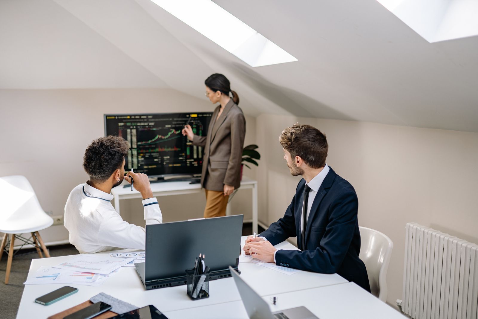 A finance team meeting in a bright office