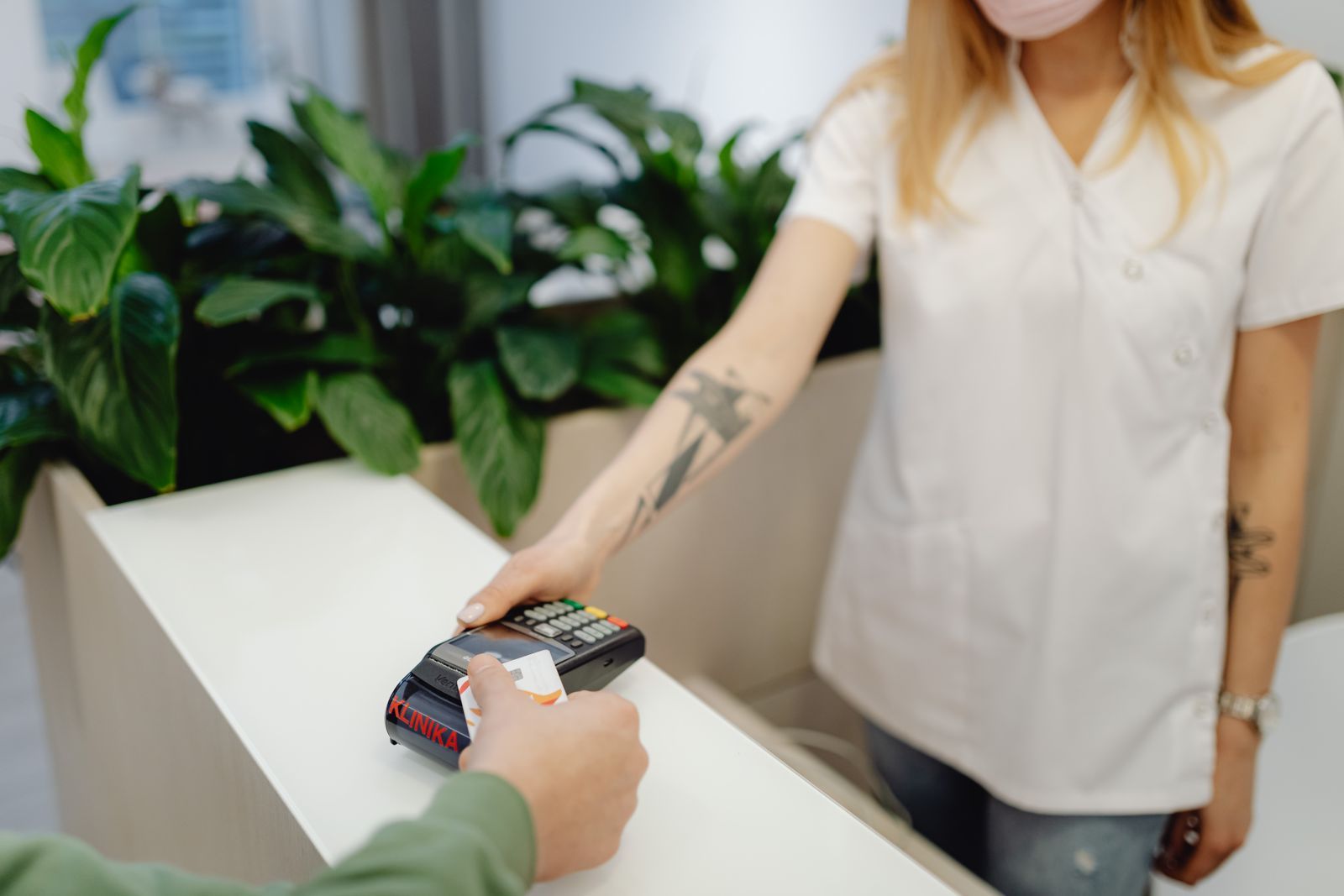 A person holding a card payment terminal